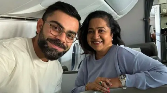 Radikaa Sarathkumar clicks selfie with Virat Kohli in flight from London to CHENNAI Tamil News 