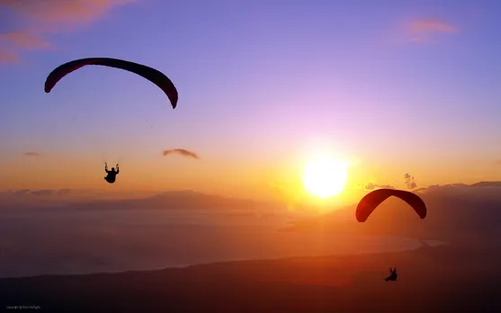Experience the thrills of paragliding in India and touch the skies!