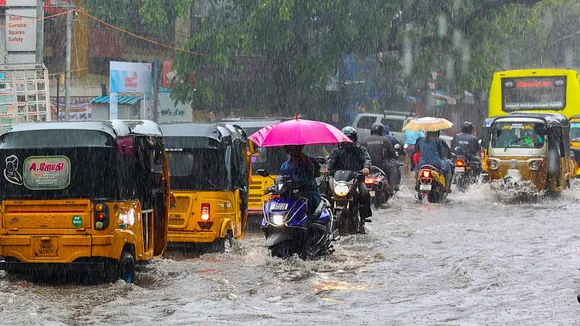 Vehicles ply on a heavily waterlogged road amid rains, in Chennai, Tuesday, Oct. 15, 2024.