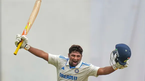 Sarfaraz Khan celebrates his century during the fourth day of the first test cricket match between India and New Zealand at M Chinnaswamy Stadium, in Bengaluru, Saturday, Oct 19, 2024.