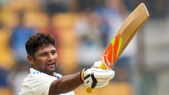 Sarfaraz Khan celebrates his maiden century during the fourth day of the first test cricket match between India and New Zealand, in Bengaluru, Saturday, Oct 19, 2024.