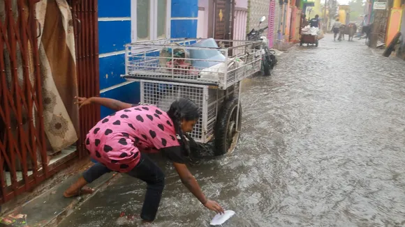 A girl plays during rain after cyclone 'Dana' impacted the regions, in Kanyakumari, Tamil Nadu, Friday, Oct 25, 2024.