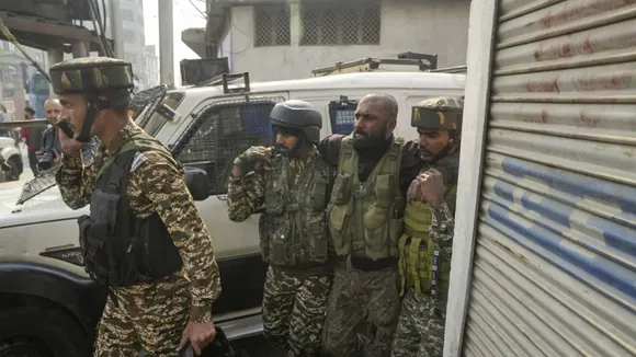 Injured security personnel being taken away be others during an encounter with terrorists at Khanyar area, in Srinagar, Saturday, Nov. 2, 2024.