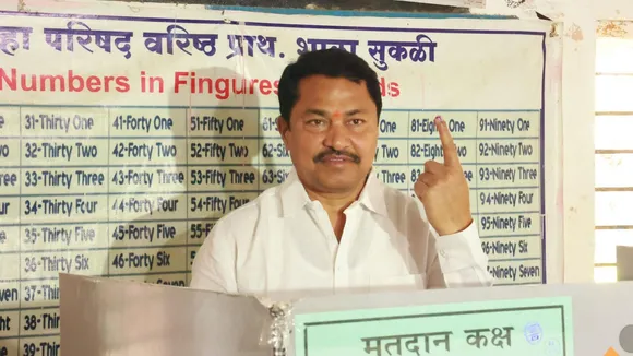 Maharashtra Congress chief Nana Patole shows his ink-marked finger after casting vote during the Maharashtra Assembly polls, at Sakoli assembly constituency in Bhandara district