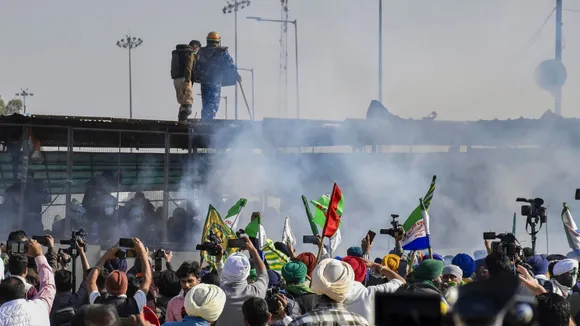 Tear gas being used by security personnel to disperse the farmers moving towards barricades during their foot march to Delhi, at Shambhu border in Patiala district, Punjab, Friday, Dec. 6, 2024.