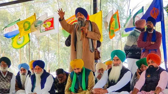 Farmer leader Sarwan Singh Pandher addresses farmers, at Shambhu border in Patiala district, Punjab, Friday, Dec. 6, 2024.