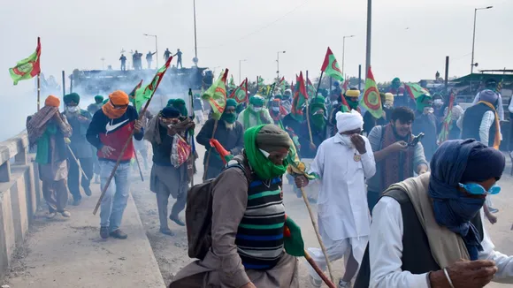 Tear gas being used to disperse protesting farmers at Shambhu Border during their foot march towards Delhi, in Patiala district, Sunday, Dec. 8, 2024.