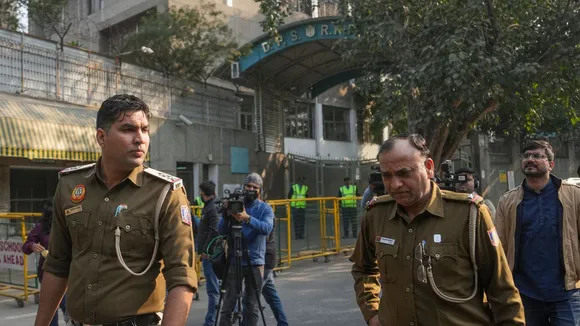 Police personnel outside DPS RK Puram during an investigation after the school received bomb threat, in New Delhi, Monday, Dec. 9, 2024.
