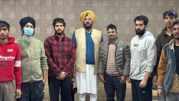 Punjab minister Dhaliwal with deported Indians