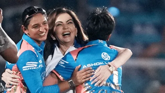 Mumbai Indians' owner Nita Ambani with skipper Harmanpreet Kaur and Sanskriti Gupta celebrates their win against Delhi Capitals in the Women's Premier League (WPL) 2025 final cricket match in Mumbai on Saturday, March 15, 2025.