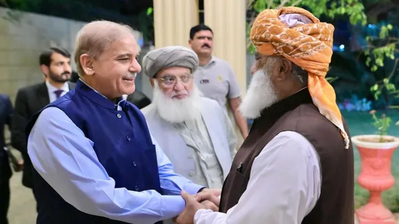 Prime Minister Shehbaz Sharif shakes hands with JUI-F chief Maulana Fazlur Rehman in Islamabad, on Thursday