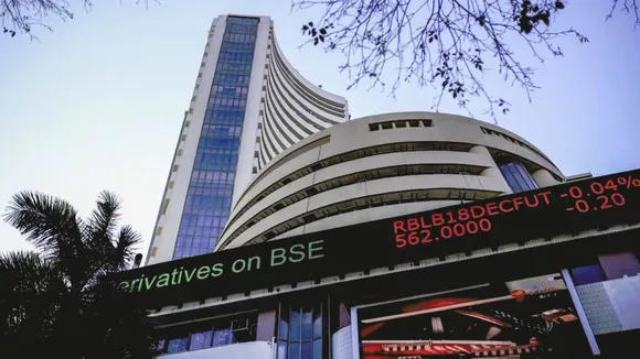 Sensex, Nifty eke out gains to settle at fresh lifetime highs