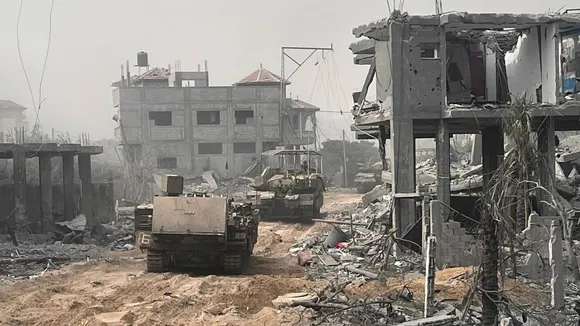 Israeli troops surround Gaza City and cut off northern part of the besieged Hamas-ruled territory