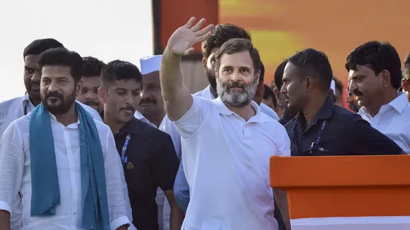 Congress leader Rahul Gandhi waves at supporters during a public meeting, in Khammam district, Sunday, July 2, 2023. TPCC President Revanth Reddy is also seen