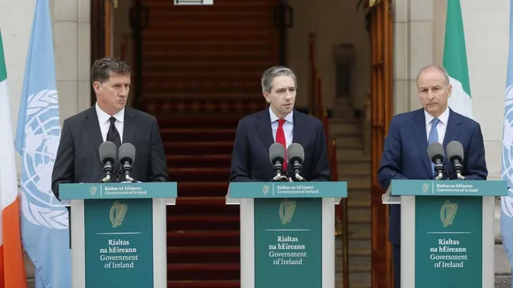 The three Irish Government leaders from left, Minister Eamon Ryan, Taoiseach Simon Harris and Tanaiste Micheal Martin speak to the media during a press conference outside the Government Buildings, in Dublin, Ireland, Wednesday May 22, 2024