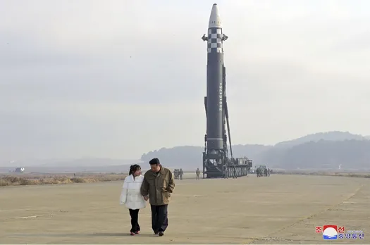 North Korea unveils Kim Jong Un's daughter at missile launch site