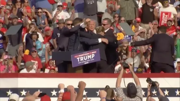Donald Trump seconds after an attack on him on Saturday