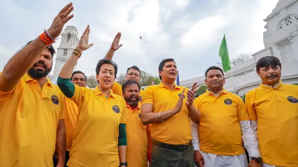 AAP MLAs arrive at Delhi Assembly wearing yellow T-shirts, 'Kejriwal' masks