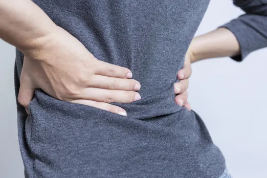 Millions across the world live with low back pain, but addressing major risk factors like smoking, obesity and workplace ergonomics could curb the trend, research shows