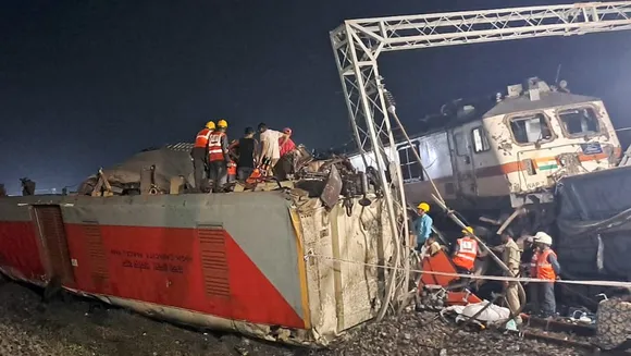 Rescuers raise buried coach at triple rail crash site; death toll at 280