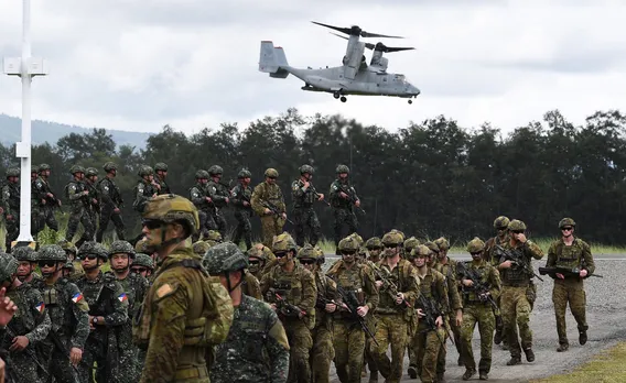 Australian, US, Filipino militaries practice retaking an island in a drill along the South China Sea