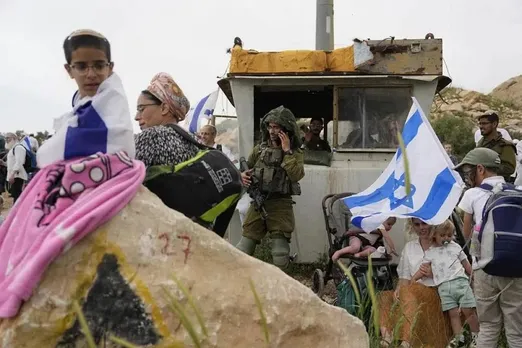 Jewish settlers erect religious school in evacuated West Bank outpost after Israel repeals ban