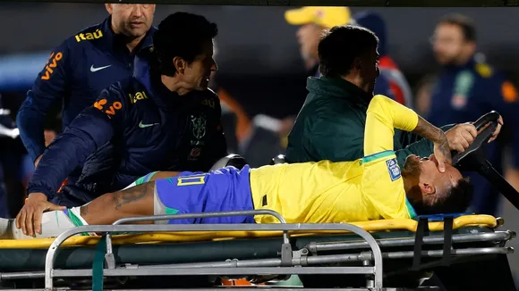 Neymar leaves Brazil match in tears with left knee injury; team doctor says severity unknown