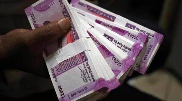 Rupee gains 11 paise to 82.77 against US dollar