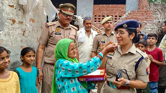 SP Bulandshahr Anukriti Sharma with an elderly woman Noorjahan after the former got electricity connection installed at the latter’s house, in Bulandshahr