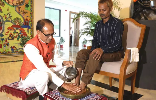 Madhya Pradesh Chief Minister Shivraj Singh Chouhan washes feet of Dashmat Rawat, Sidhi urination case victim, at CM House, in Bhopal, Thursday, July 6