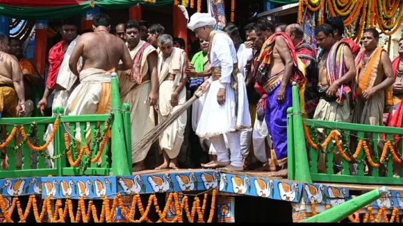 Puri Maharaja sweeps chariots as part of Rath Yatra rituals