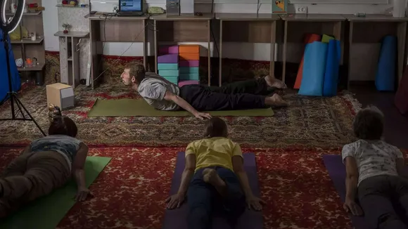 Yoga in a basement helps people in a Ukrainian front-line city cope with Russia's constant shelling