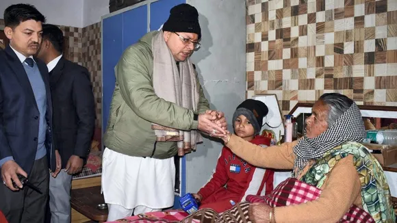 Uttarakhand Chief Minister Pushkar Singh Dhami interacts with the residents affected by land subsidence in Joshimath, at a relief camp