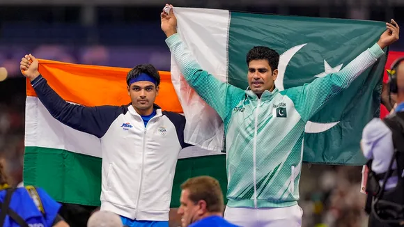 Silver medallist India's Neeraj Chopra and Gold medallist Pakistan's Arshad Nadeem celebrate after the men's javelin throw final at the 2024 Summer Olympics, in Paris, France, Thursday, Aug. 8, 2024.