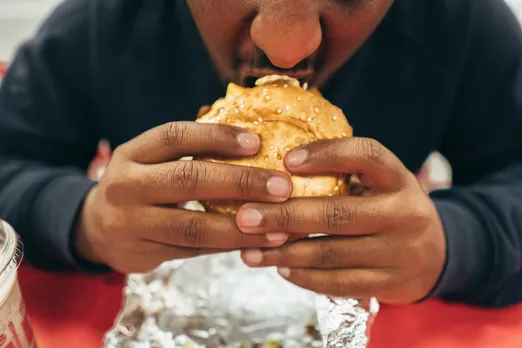 Man eating burger