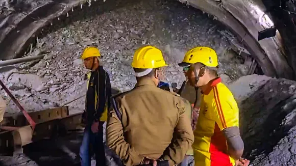 Rescue and relief operations underway after a portion of an under-construction tunnel collapsed, in Uttarkashi district, Tuesday, Nov. 14, 2023.