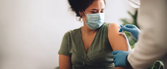Woman receives vaccination