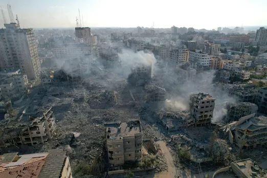 Smoke rising from bombed buildings in Gaza City after Israeli bombing.