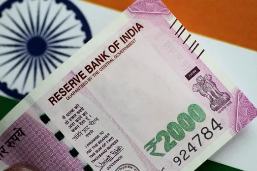 Rupee rises 36 paise to close at 79.17 against US dollar