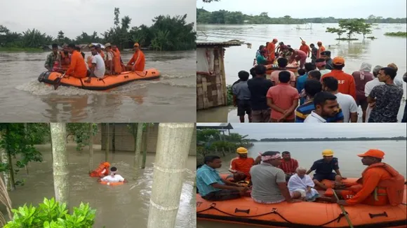 Bright orange-coloured rescue personnel silver lining amid flood catastrophe in Assam