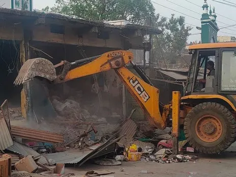 Groom prefers bulldozer over horse or car for marriage procession