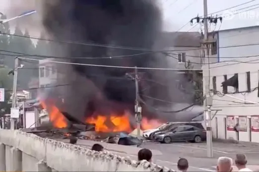 Plane crashes in China, sets houses on fire