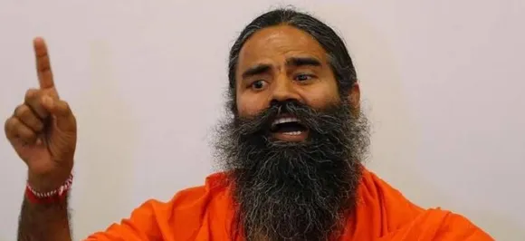 Seen as a snub for Narendra Modi, yoga guru Ramdev says, 'Difficult to say who would be next PM' 