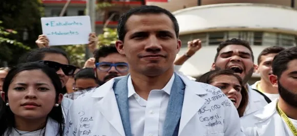 Venezuela's Juan Guaido to leave for Colombia as aid standoff hardens