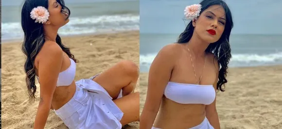 Watch: Nia Sharma sports edgy beach look in all white ensemble and red pucker!