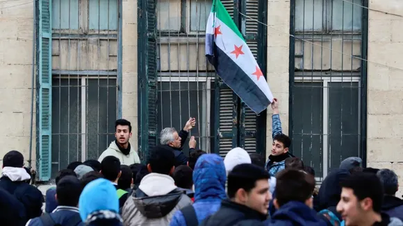 syria coup bashar al assad overthrown rebel government Assures minority safety
