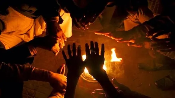 warm hands in fire in winter