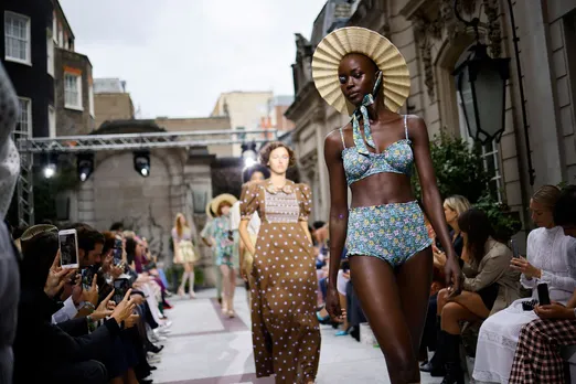 Models present creations from design house Paul & Joe, founded by French designer Sophie Mechaly, during a catwalk show for the Spring/Summer 2022 collection on the fourth day of London Fashion Week in London on Sept. 20, 2021.