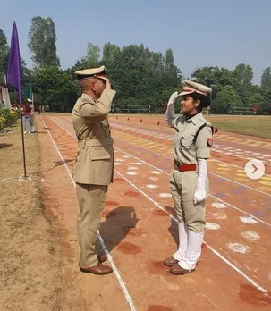 Officer father receive salute from Police officer daughter