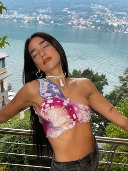 Dua Lipa Artfully Accessorizes With Wired Headphones | Vogue